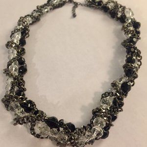 Necklace, triple strand, black & clear beads